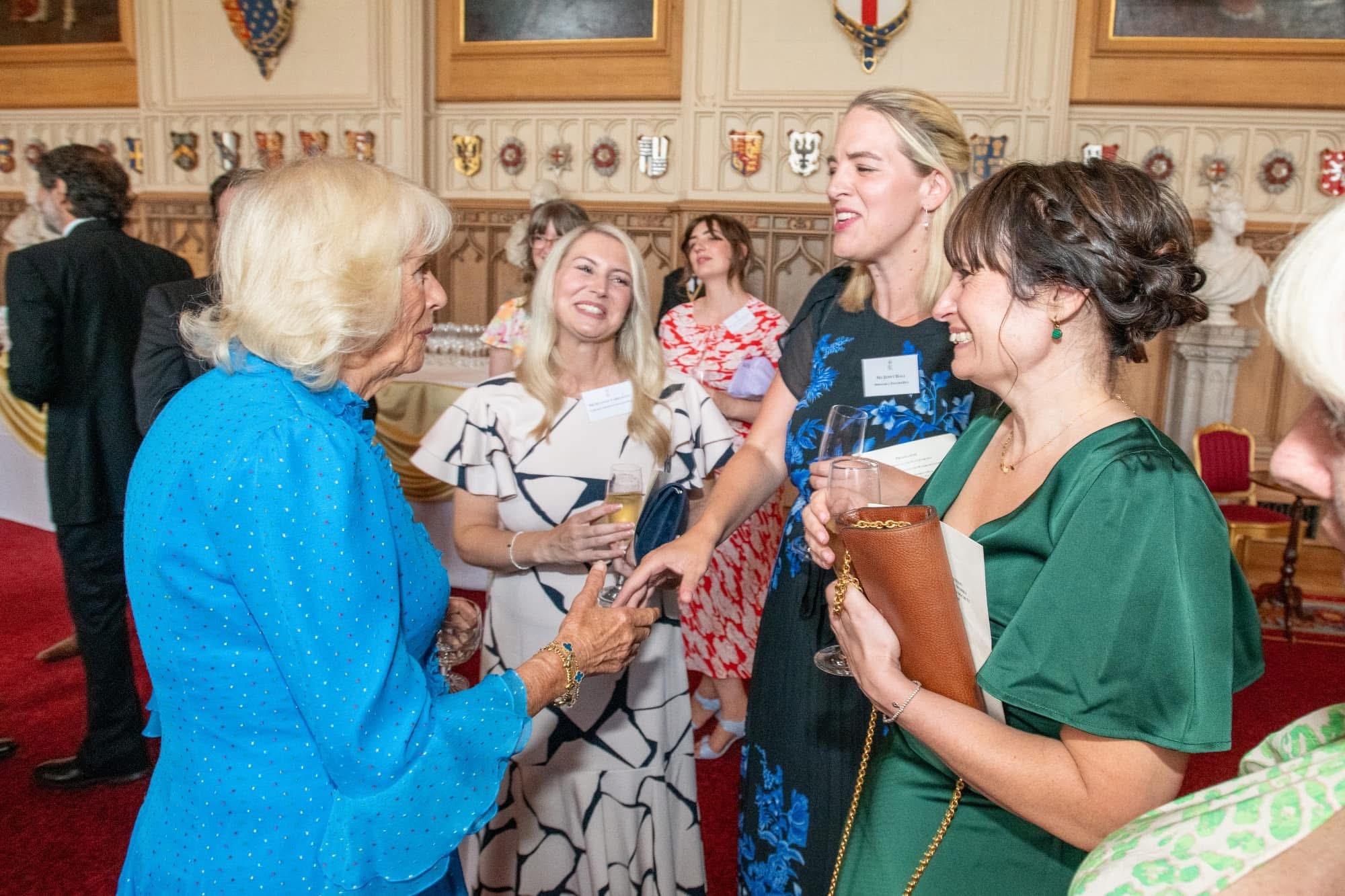 Image of some people including the deputy chatting to the Queen